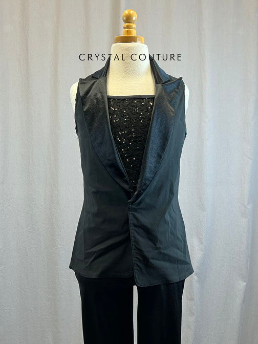 Black sequin unitard with flare bottoms and black vest