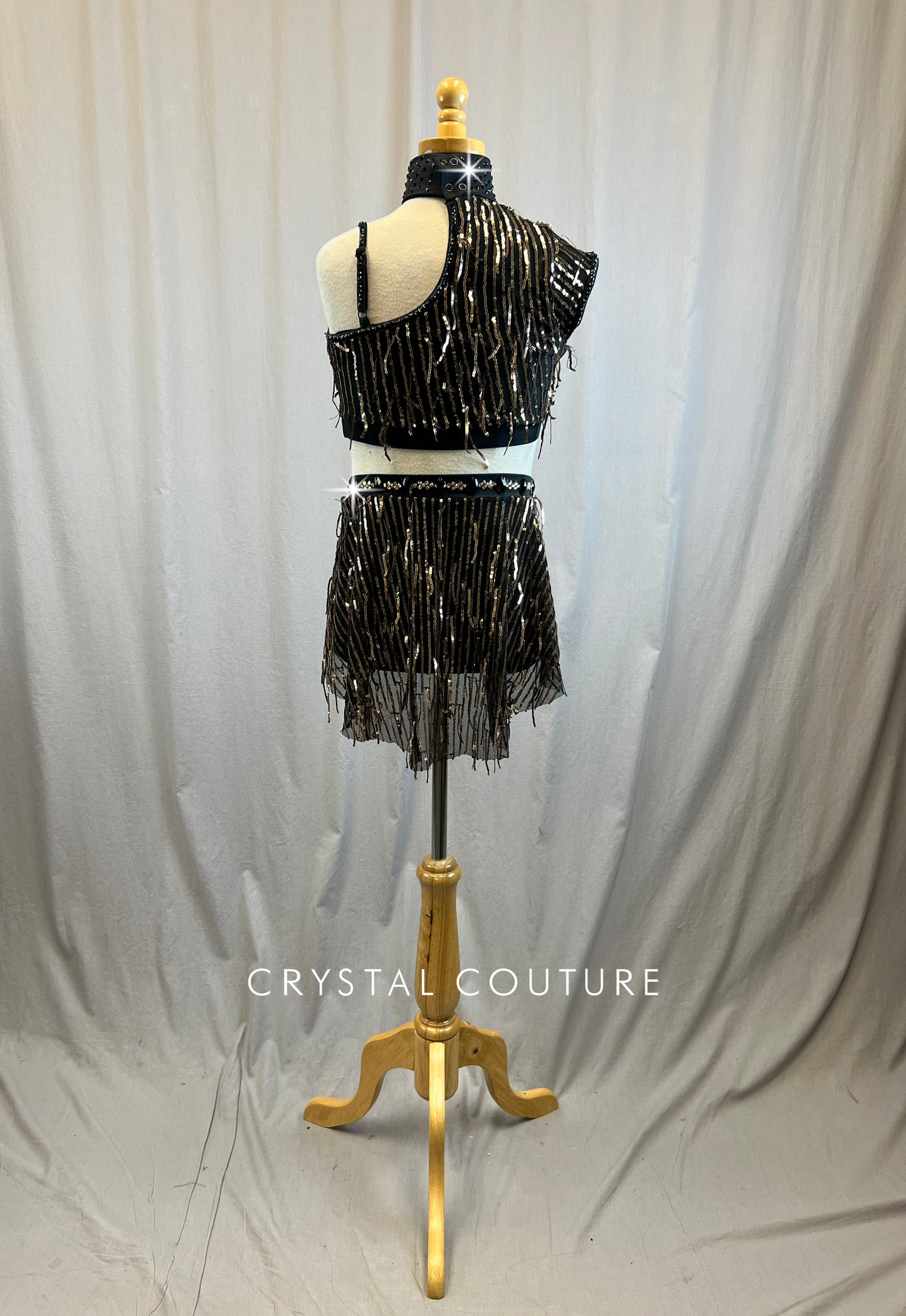 Black and gold sequin mock neck set with black applique embellishment. -Rhinestones