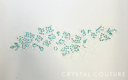 White Embroidered Floral Applique with Teal Holographic Spangles.