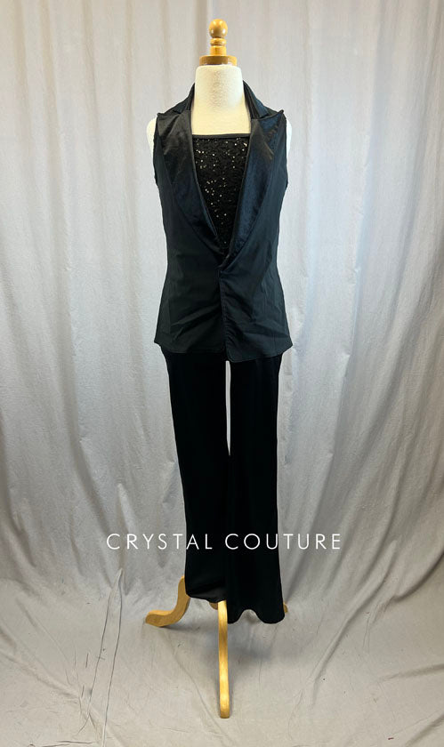 Black sequin unitard with flare bottoms and black vest