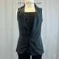 Black sequin unitard with flare bottoms and black vest