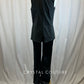 Black sequin unitard with flare bottoms and black vest