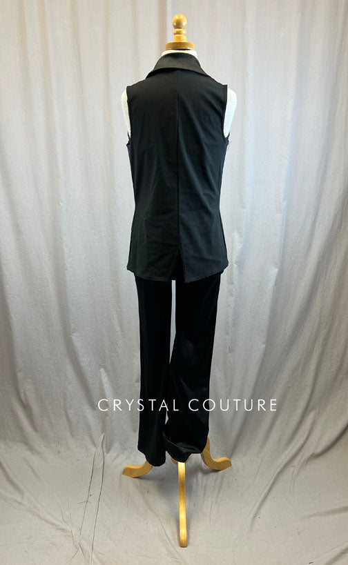Black sequin unitard with flare bottoms and black vest