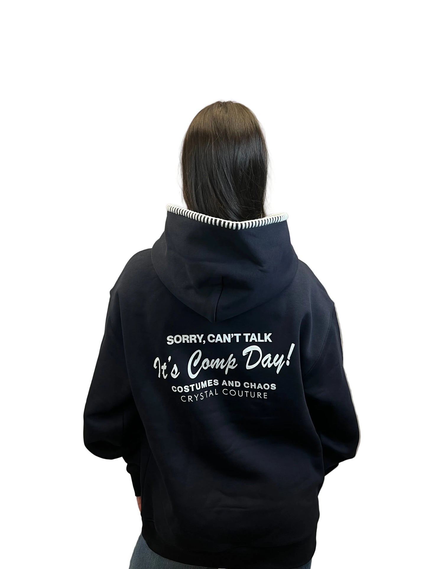 Person wearing a black hoodie with text 