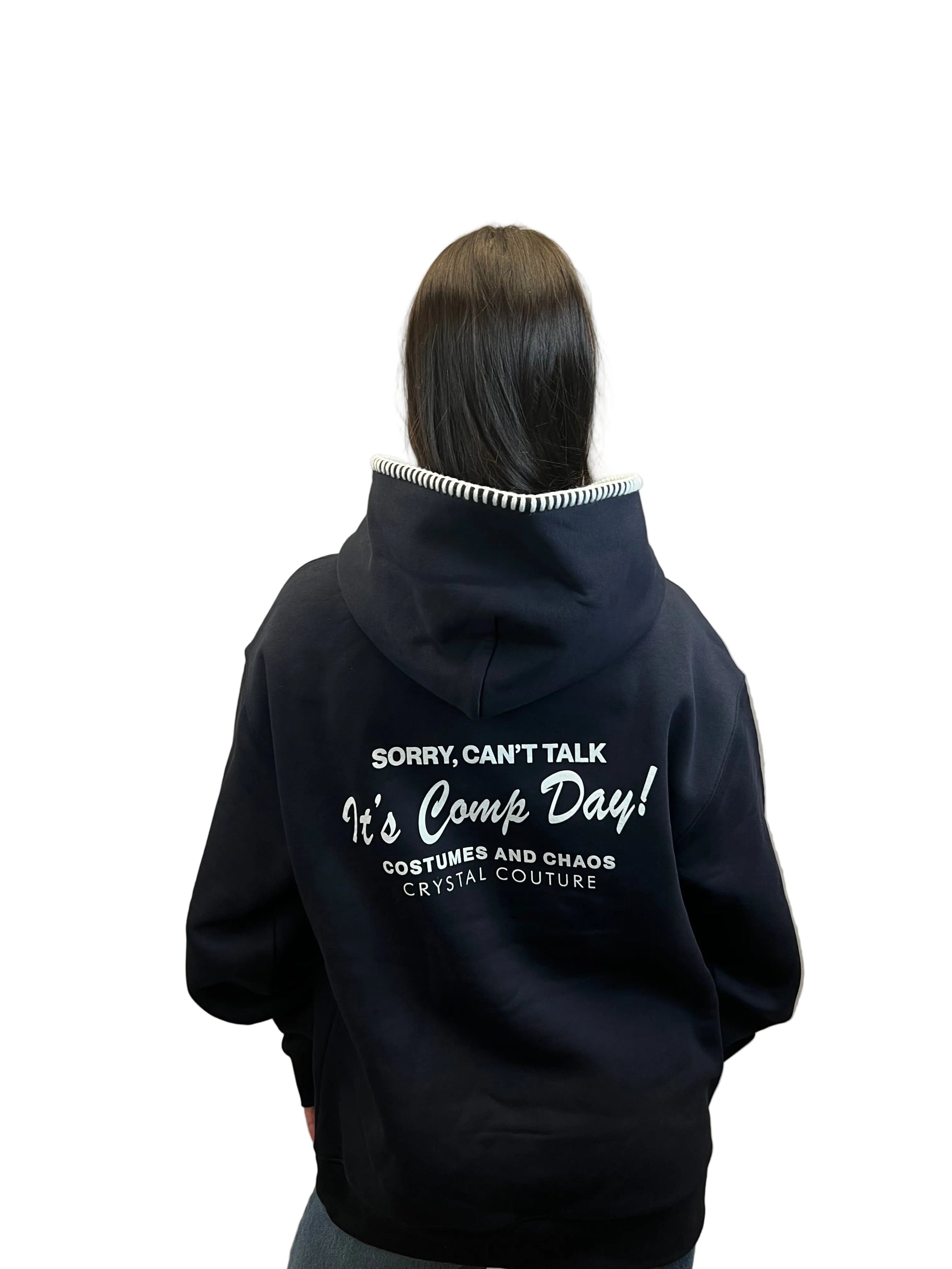 Person wearing a black hoodie with text 